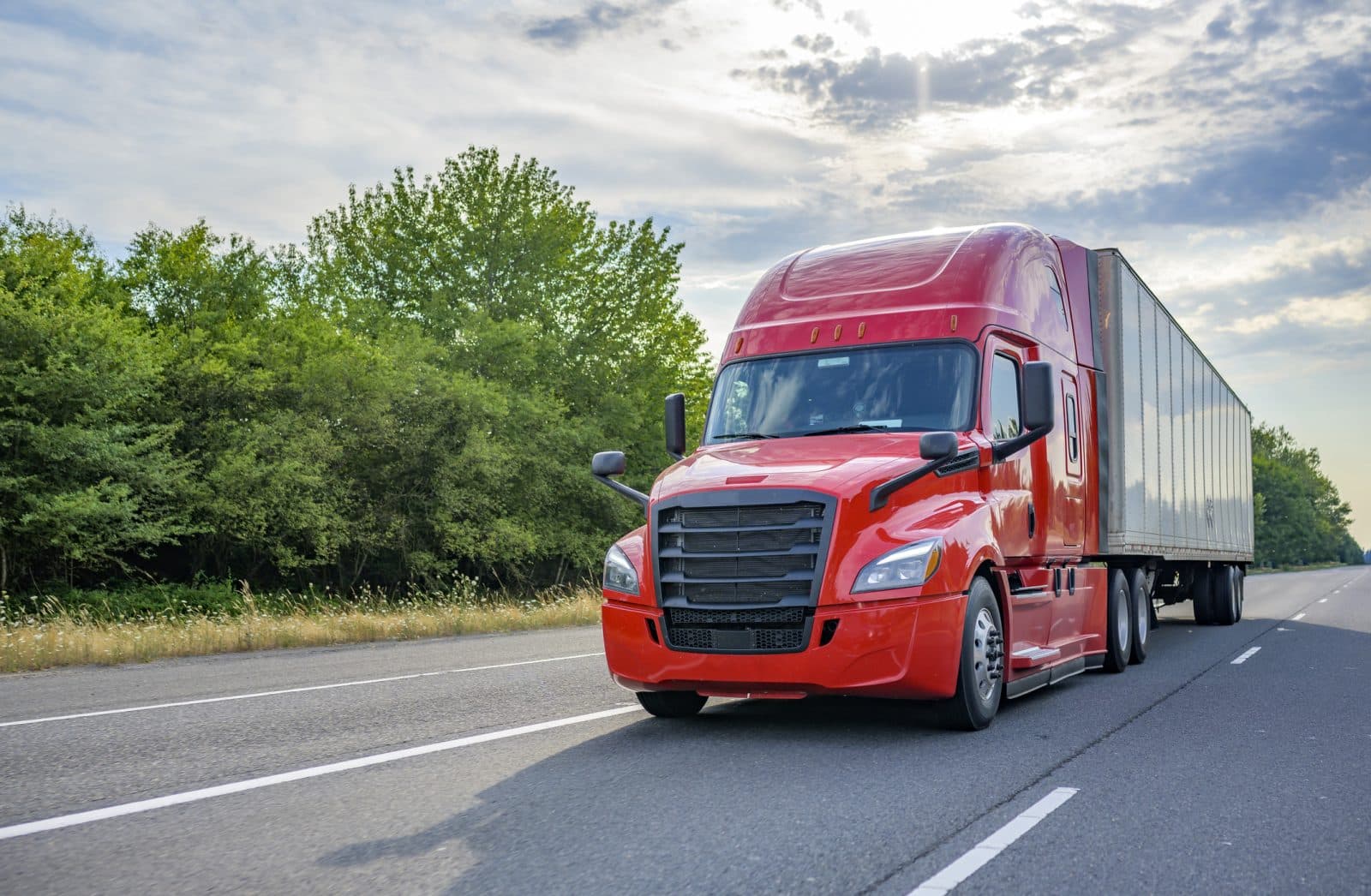 A semi-truck driving down the interstate.
